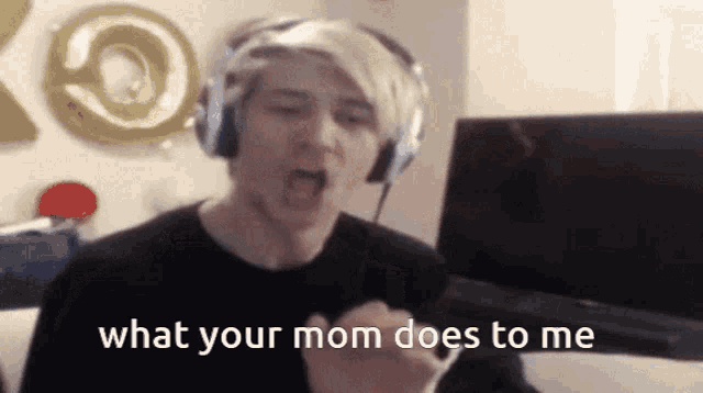 a man wearing headphones is screaming and says what your mom does to me
