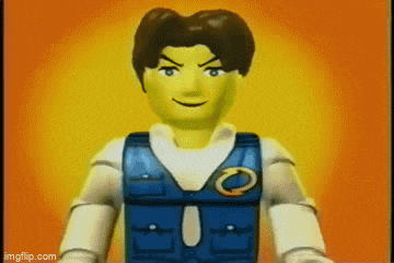 a lego man with a badge on his chest is smiling .