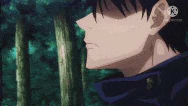 a close up of a man 's face in a forest .