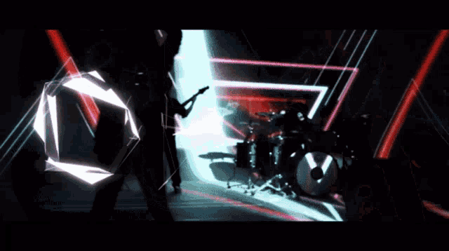 a man playing a guitar and a drummer playing drums