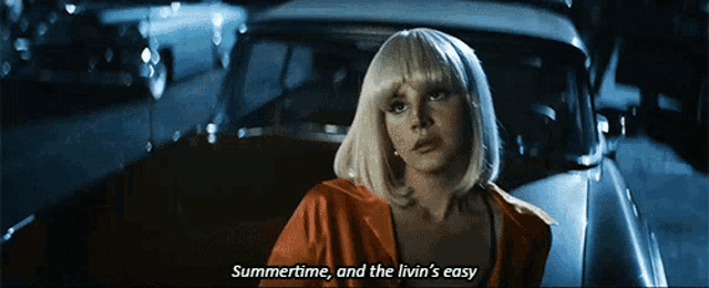 a woman in a wig says summertime and the livin 's easy in front of a car