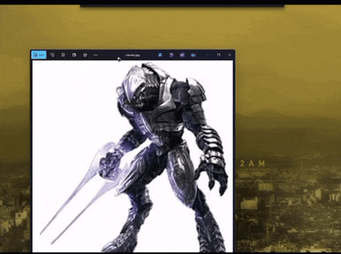a computer screen shows a picture of a robot holding a sword and the time is 2am