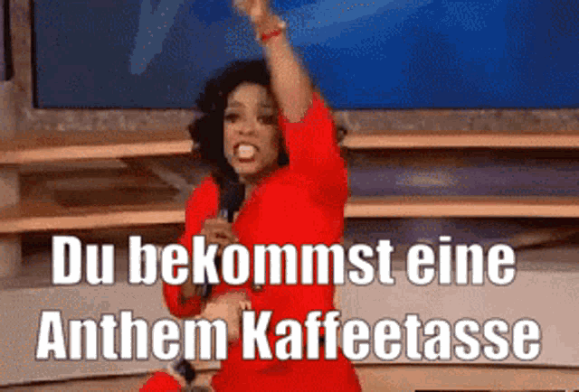 a woman in a red dress singing into a microphone with the words du bekommst eine anthem kaffeetasse