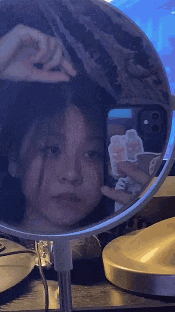 a person taking a picture of themselves in a mirror with a sticker on their phone that says i love you