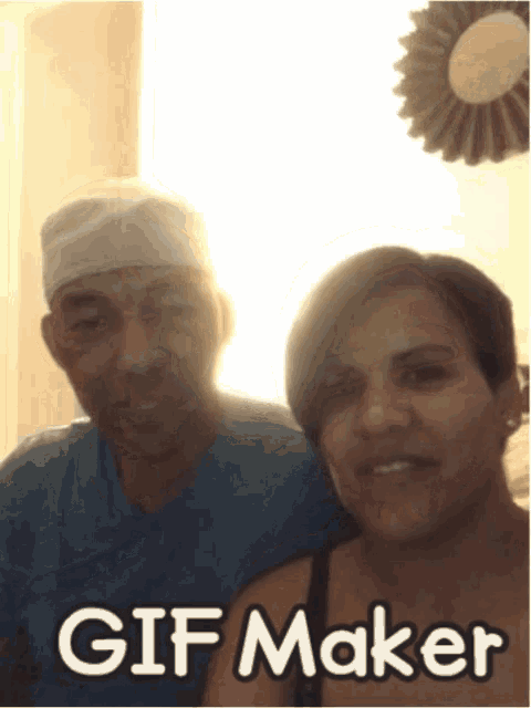 a man and woman are posing for a picture with the words gif maker behind them