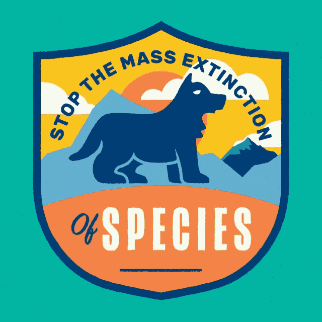 a badge with a wolf and the words stop the mass extinction of species