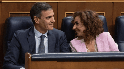 a man and a woman are sitting next to each other