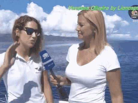 a woman holding a microphone with the name vanessa oliveira by lioncape on the bottom