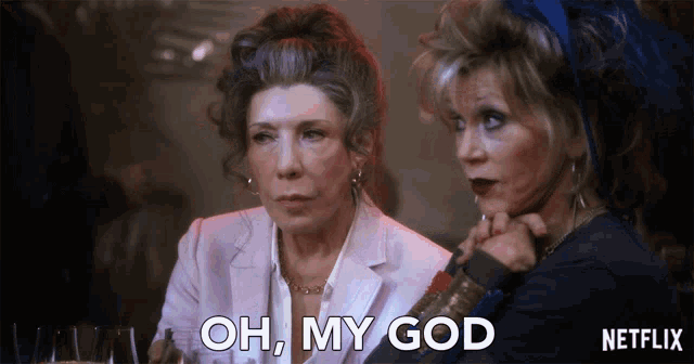 two women sitting next to each other with the words oh my god written on the bottom