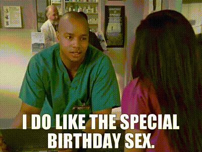a man in a green scrub is talking to a woman in a pink scrub .