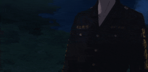 a man with glasses is smiling in front of a full moon in the sky