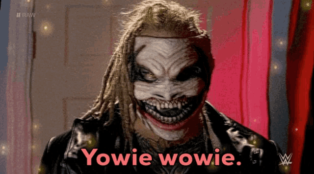 a man with dreadlocks is wearing a clown mask and says yowie wowie