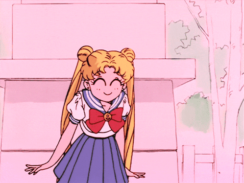 a girl in a sailor suit with a red bow on her top