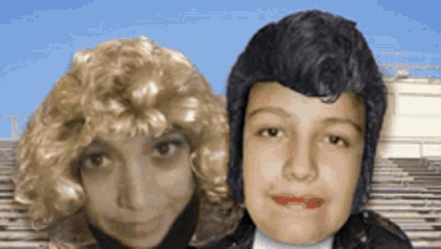 a woman with blonde hair and a man with black hair