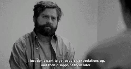a man with a beard is talking to another man in a black and white photo with a quote .