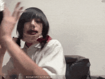a woman with a nose ring is wearing a white shirt with a red bow tie