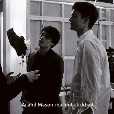a black and white photo of aj and mason talking