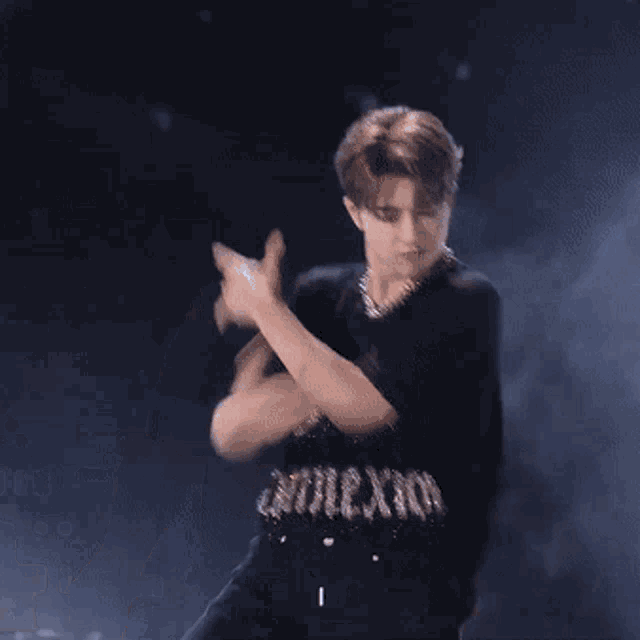 a man wearing a black shirt that says faith connexion on it