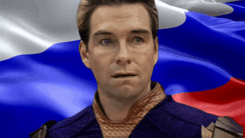 a man in front of a russian flag looks surprised
