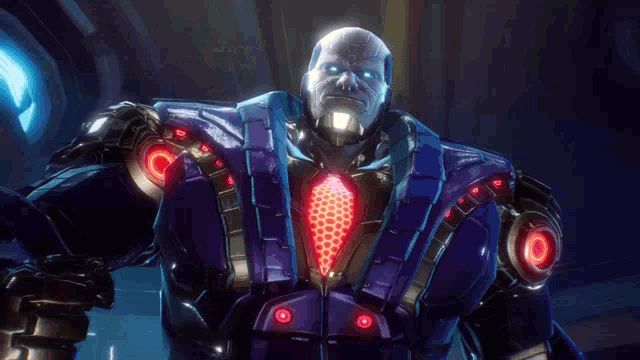 a man in a blue suit and tie is standing in a dark room .