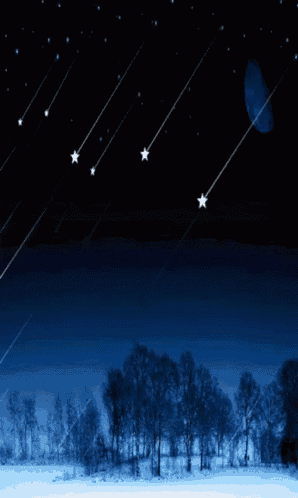 the moon is visible in the night sky above a snowy landscape