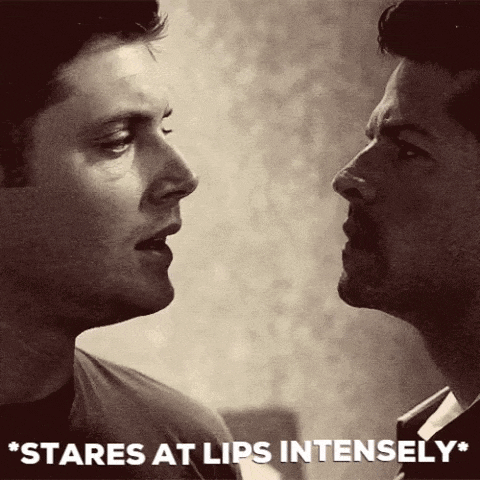 two men are looking at each other and the words stares at lips intensely