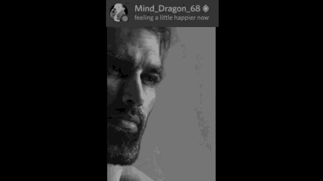 a man with a beard is smiling in a black and white photo with the name mind_dragon_68 on the bottom