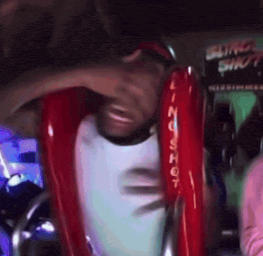 a man is riding a roller coaster that says lincsshot