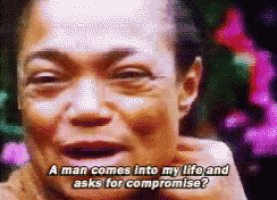a close up of a woman 's face with the words " a man comes into my life and asks for compromise "