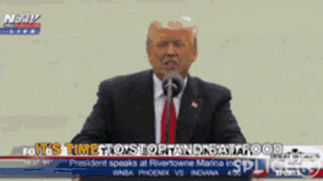donald trump is giving a speech in front of a crowd with the words it 's time to stop and eat food