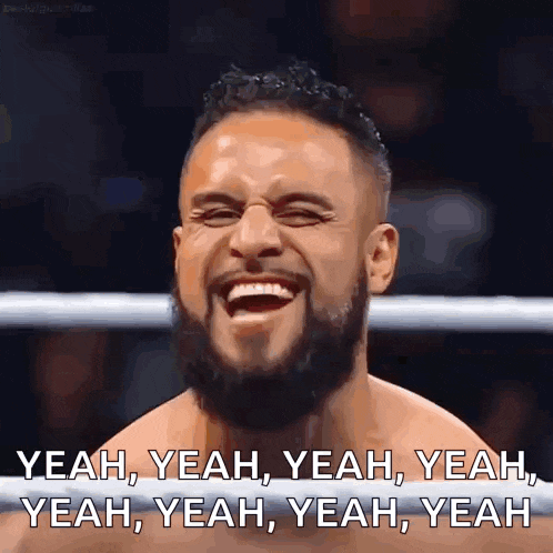 a man with a beard is laughing in a boxing ring with the caption yeah yeah yeah yeah yeah yeah