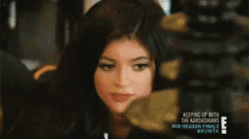 a close up of a woman 's face with the words keeping up with the kardashians in the corner