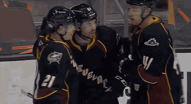 a hockey player wearing a jersey that says 21 on it