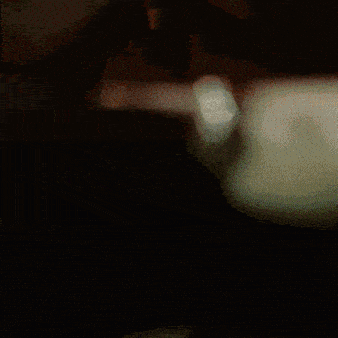 a painting of a woman 's face with a red light behind her