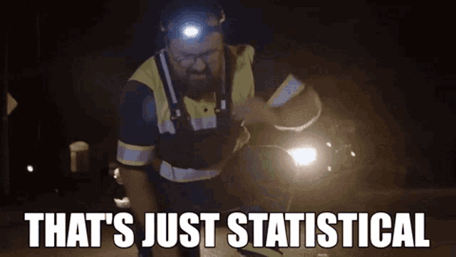 a man wearing a headlight is running down a street at night and says that 's just statistical