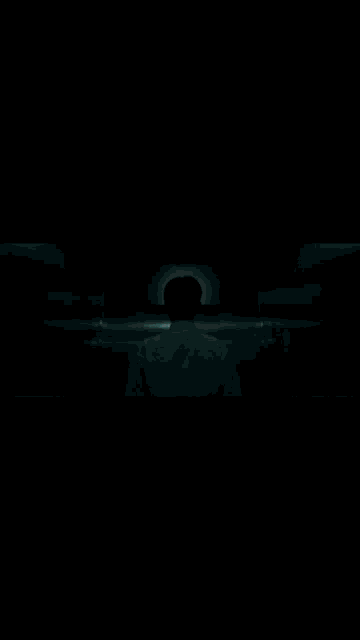 a light is shining through a doorway in the dark