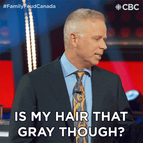 a man in a suit and tie is asking is my hair that gray though