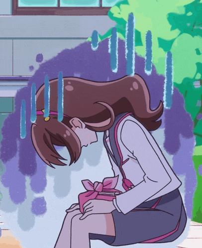 a girl in a school uniform sits with her head down in front of a window