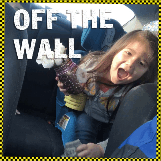 a little girl in a car seat with the words off the wall written above her