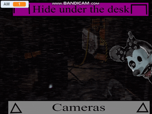 a screenshot of a video game that says hide under the desk and cameras
