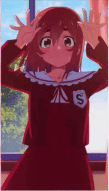 a girl in a red dress is standing in front of a window with her hands on her head .