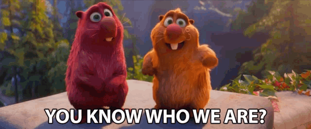 two stuffed animals standing next to each other with the words you know who we are