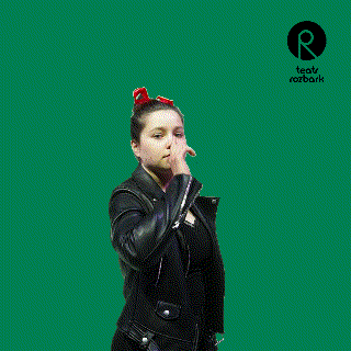 a woman with a red bow in her hair is standing in front of a green background that says teatr rozbark on it