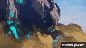 a gif of a monster coming out of the ground with the words make a gif.com at the bottom