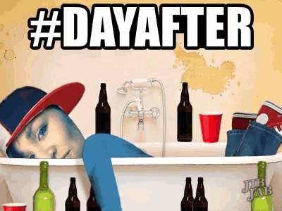 a man is laying in a bathtub surrounded by bottles of beer and red cups
