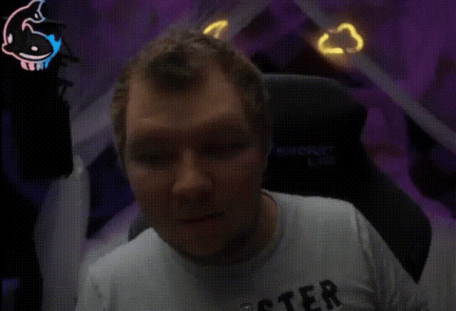 a man wearing a hollister t-shirt looks surprised