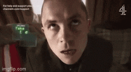 a man looking up at a screen that says take the 1 c