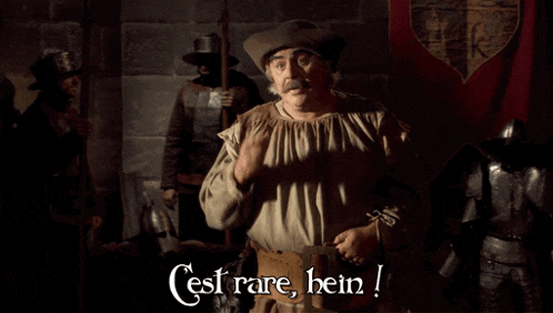 a man in a medieval outfit says c'est rare bein