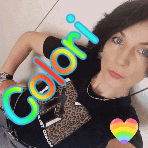 a woman is wearing a black shirt with the word colori on it