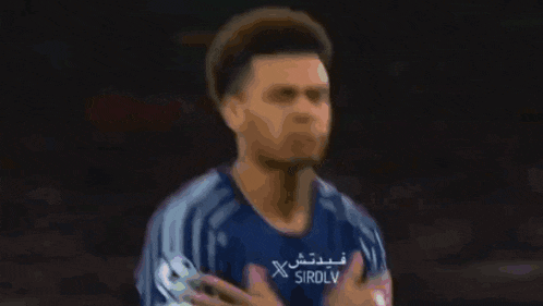 a blurry picture of a person wearing a shirt that says sirdlv on it